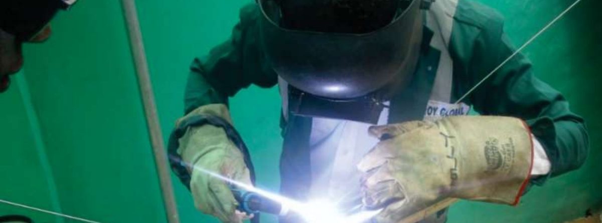 Roy Global technician welding on site